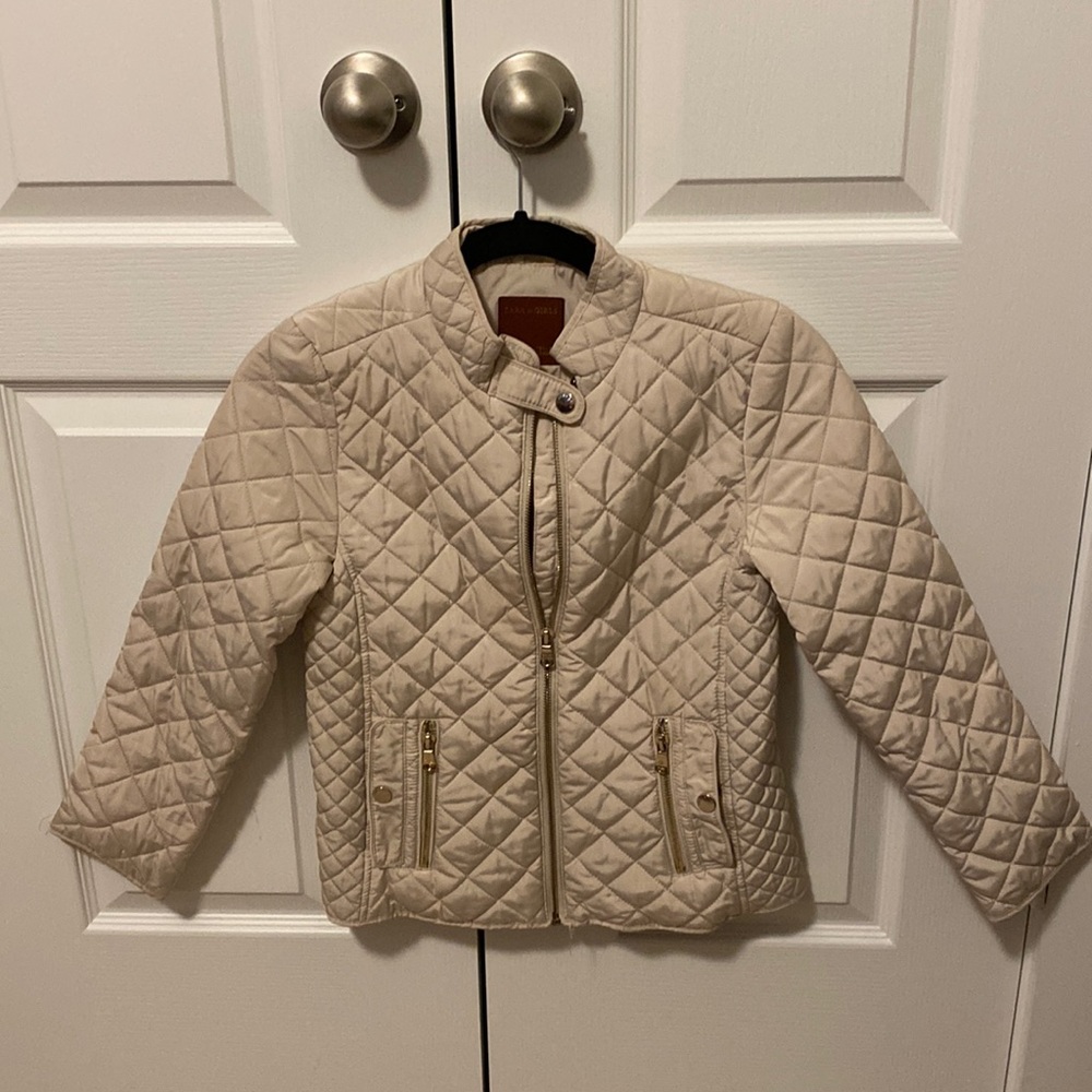 Girls beige with gold zippers.